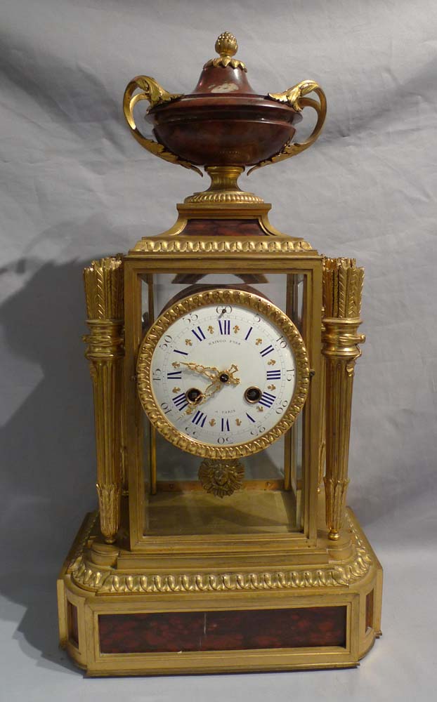 Antique French rouge marble and ormolu four glass clock signed