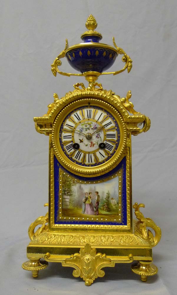Antique French mantel clock in porcelain and ormolu.