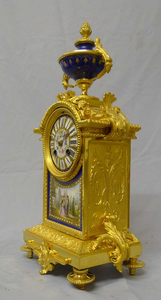Antique French mantel clock in porcelain and ormolu.