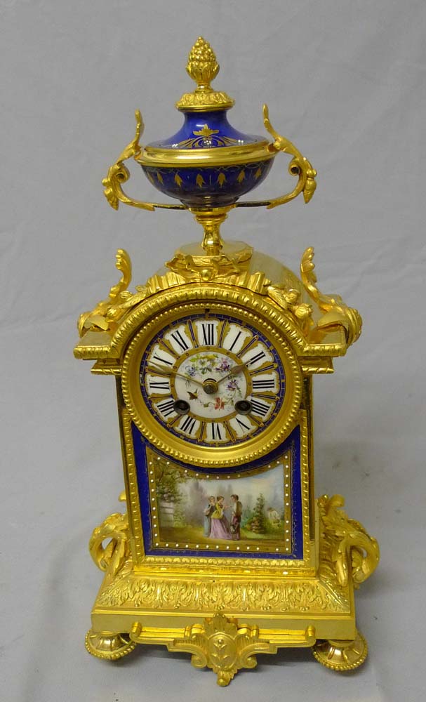 Antique French mantel clock in porcelain and ormolu.