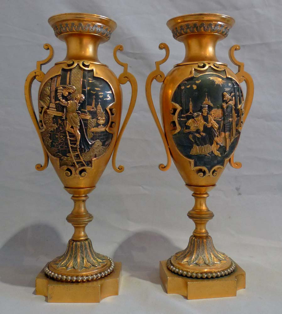 Antique French gilt and silvered bronze clock set with unusual panels.