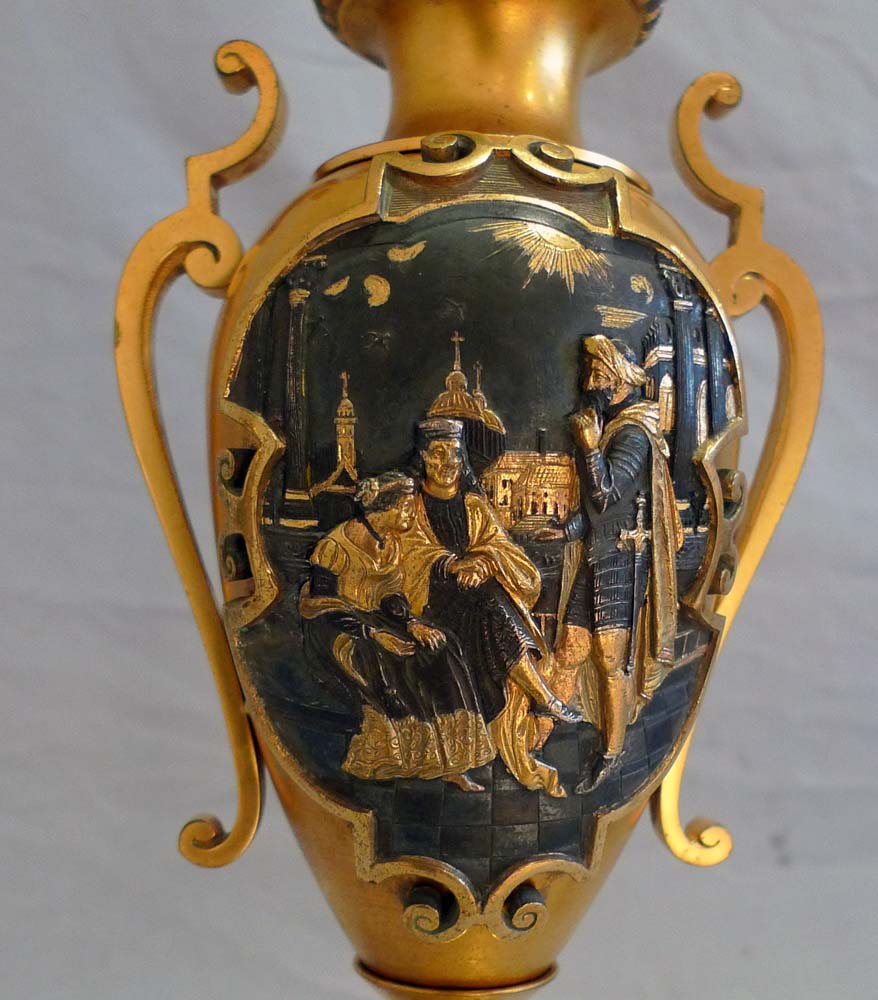 Antique French gilt and silvered bronze clock set with unusual panels.