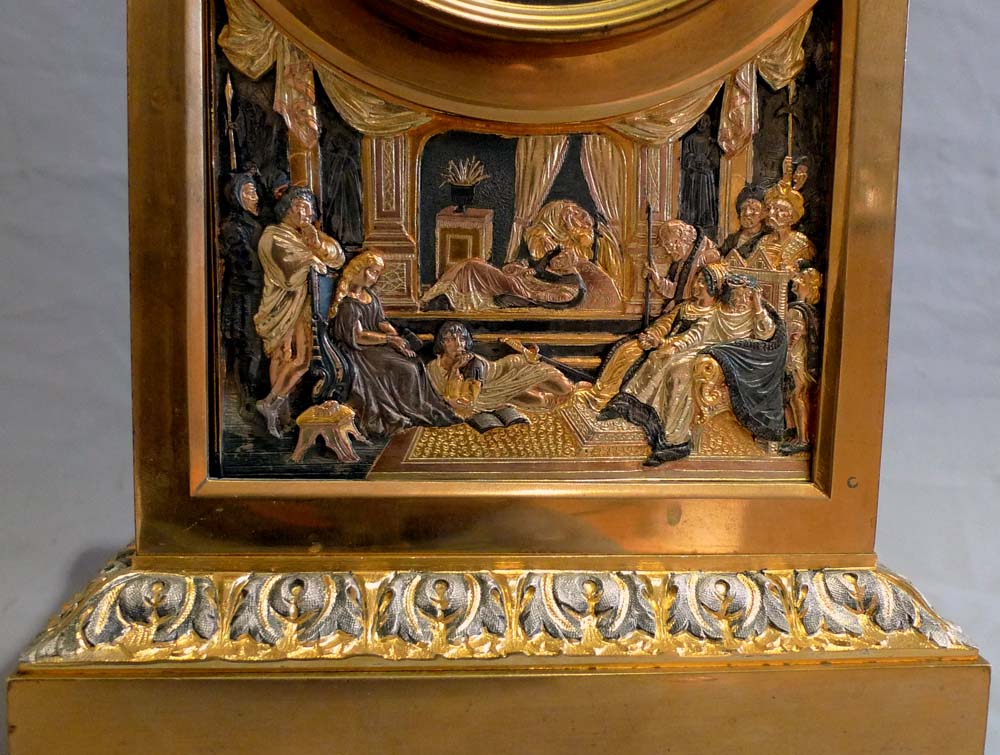 Antique French gilt and silvered bronze clock set with unusual panels.