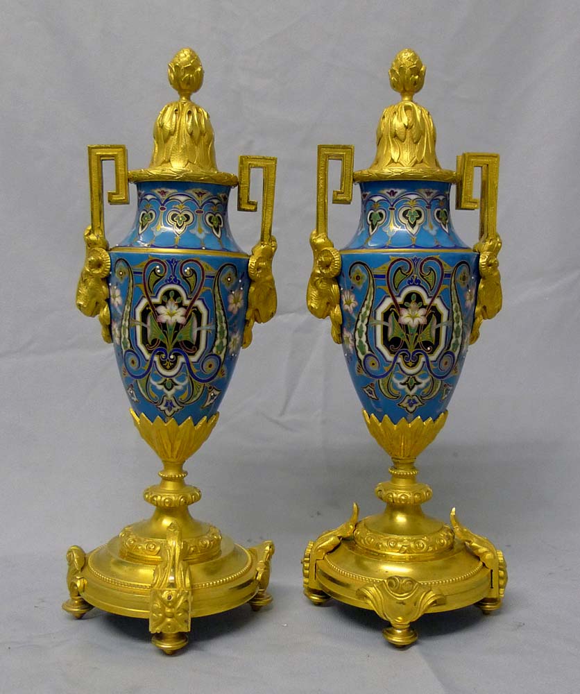Antique porcelain and ormolu mantel clock set in blue with geometric moorish patterns.