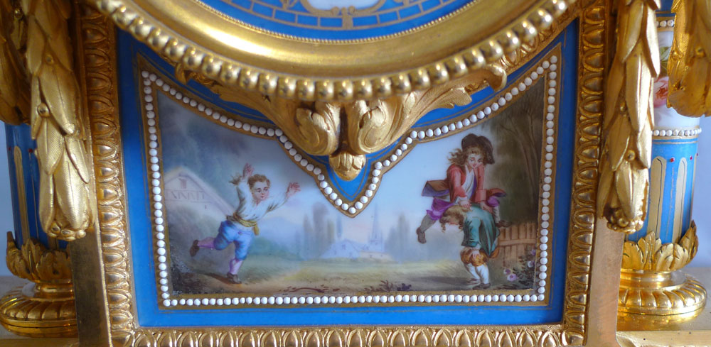 Big antique French ormolu and jewelled porcelain clock with hand painted panels of children playing.