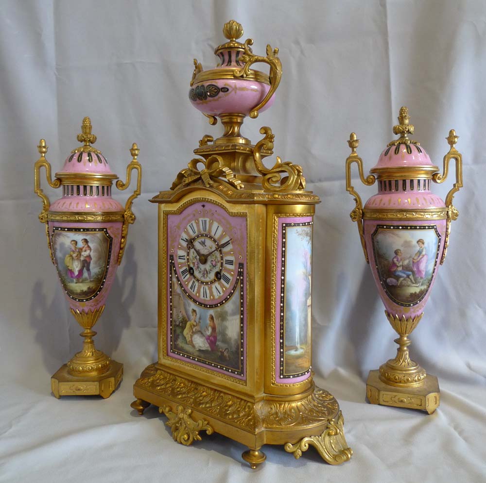Antique French porcelain and ormolu clock set.