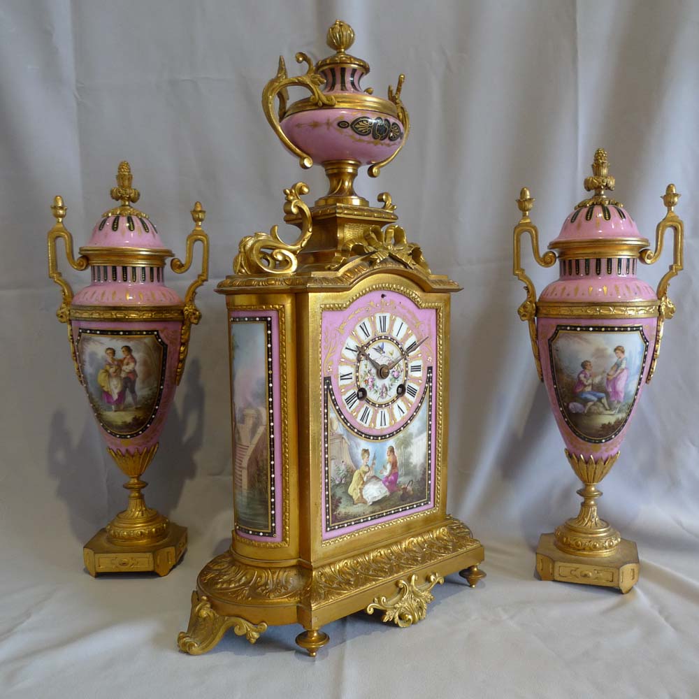 Antique French porcelain and ormolu clock set.