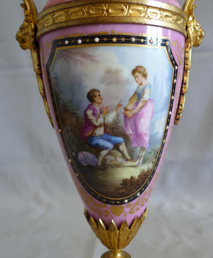 Antique French porcelain and ormolu clock set.
