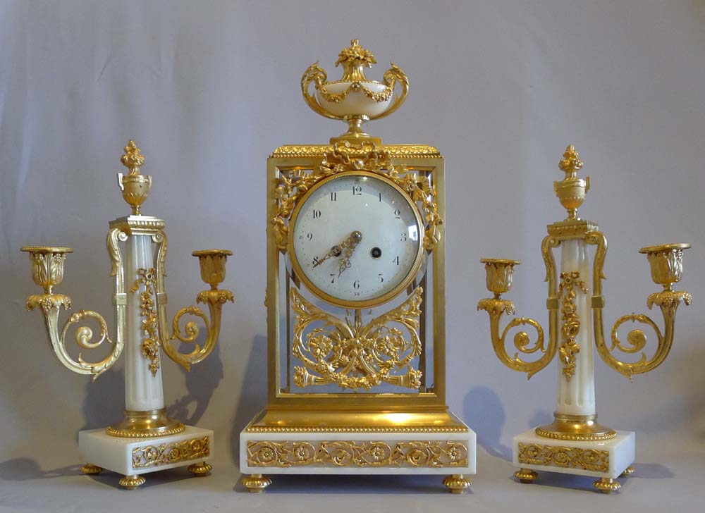 Antique French, white marble and ormolu four glass clock set.