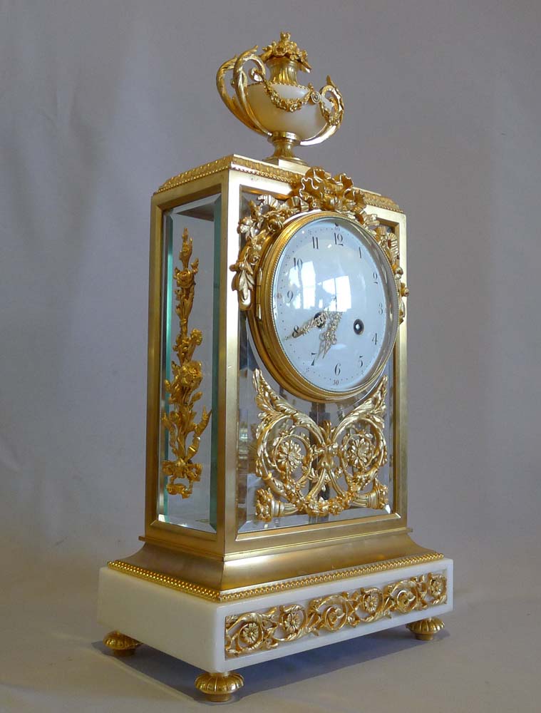 Antique French, white marble and ormolu four glass clock set.
