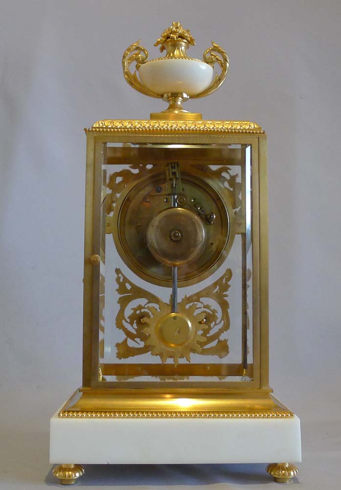 Antique French, white marble and ormolu four glass clock set.
