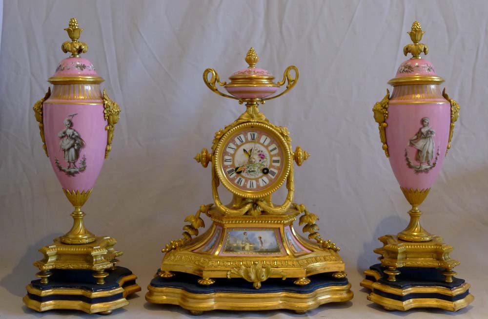 Antique French porcelain and ormolu clock set.