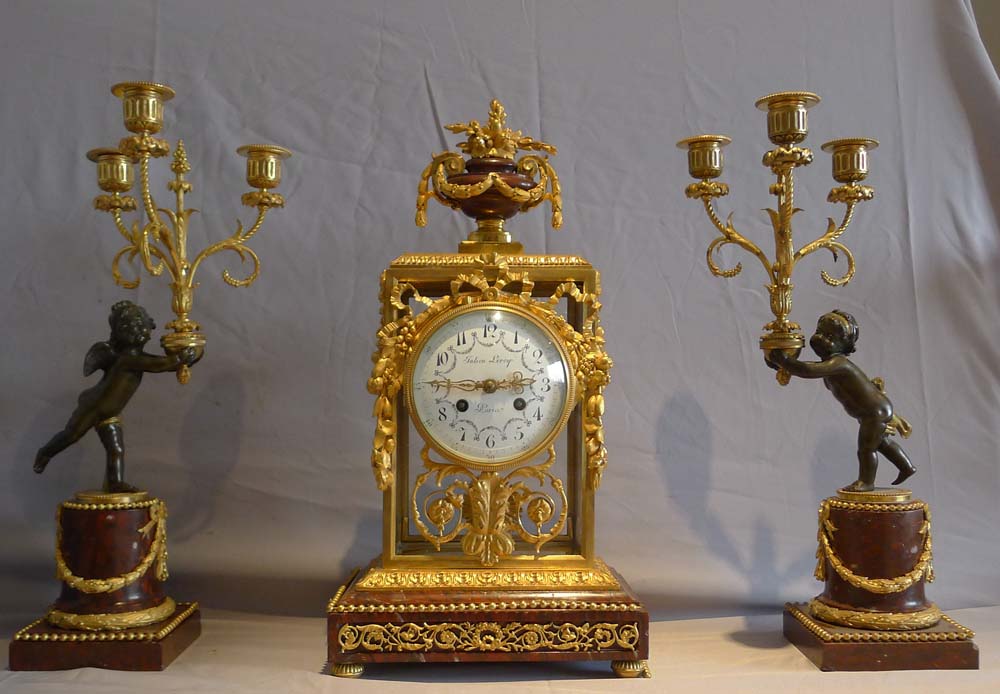 Antique French rouge marble and ormolu clock set with diial signed Julian Leroy a Paris.