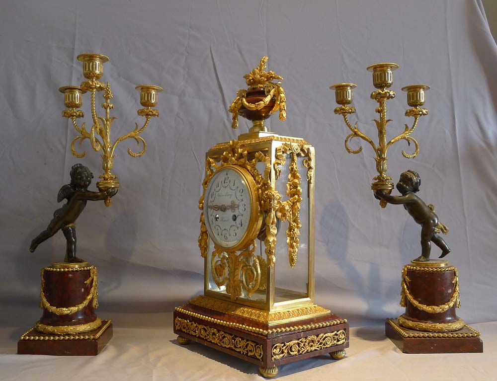 Antique French rouge marble and ormolu clock set with diial signed Julian Leroy a Paris.