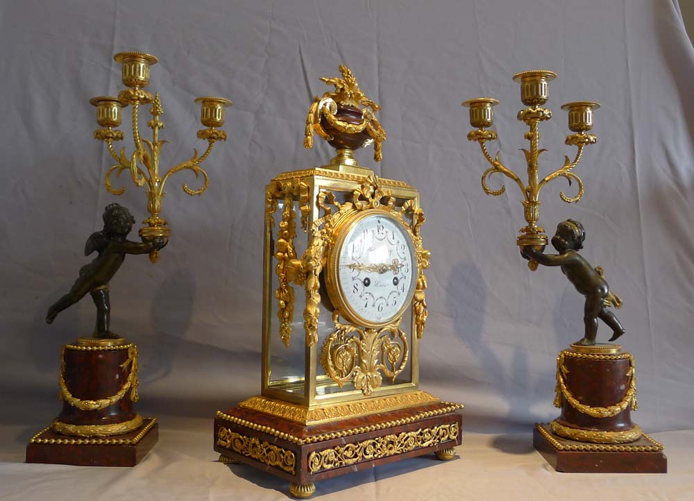 Antique French rouge marble and ormolu clock set with diial signed Julian Leroy a Paris.
