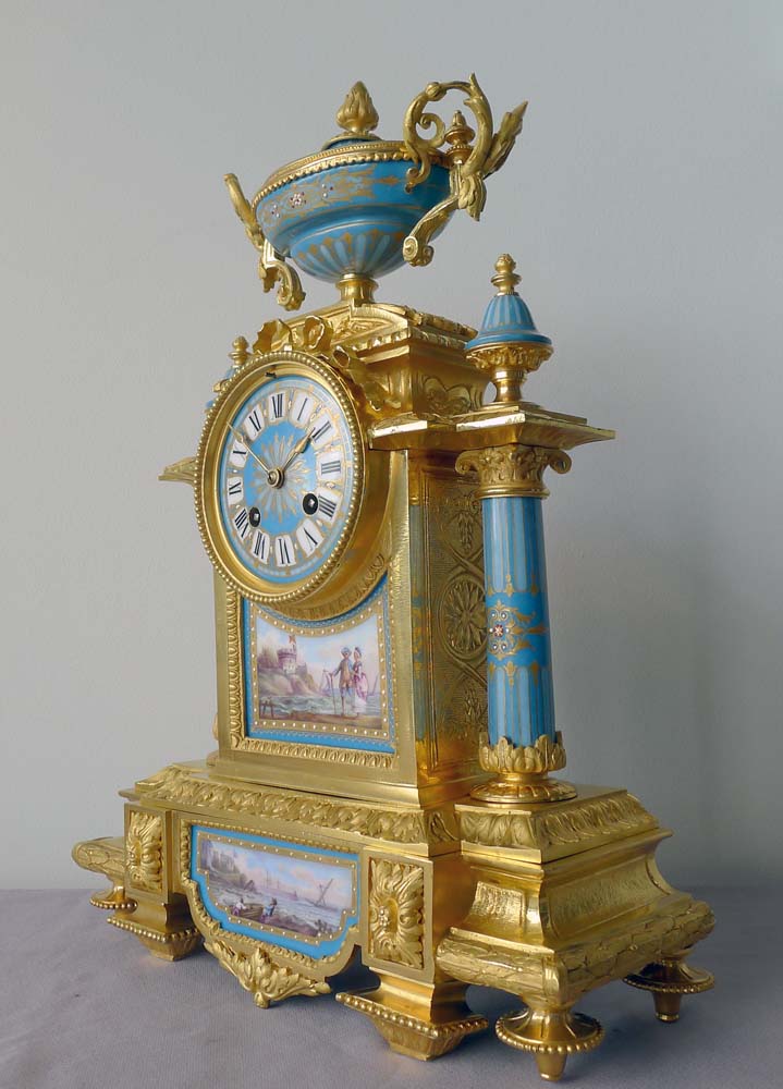 Antique French porcelain and ormolu mantel clock with Sevres style plaques.
