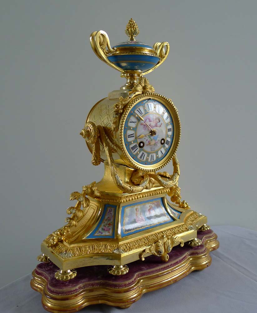 Antique French Napoleon III porcelain and ormolu mantel clock under glass dome.