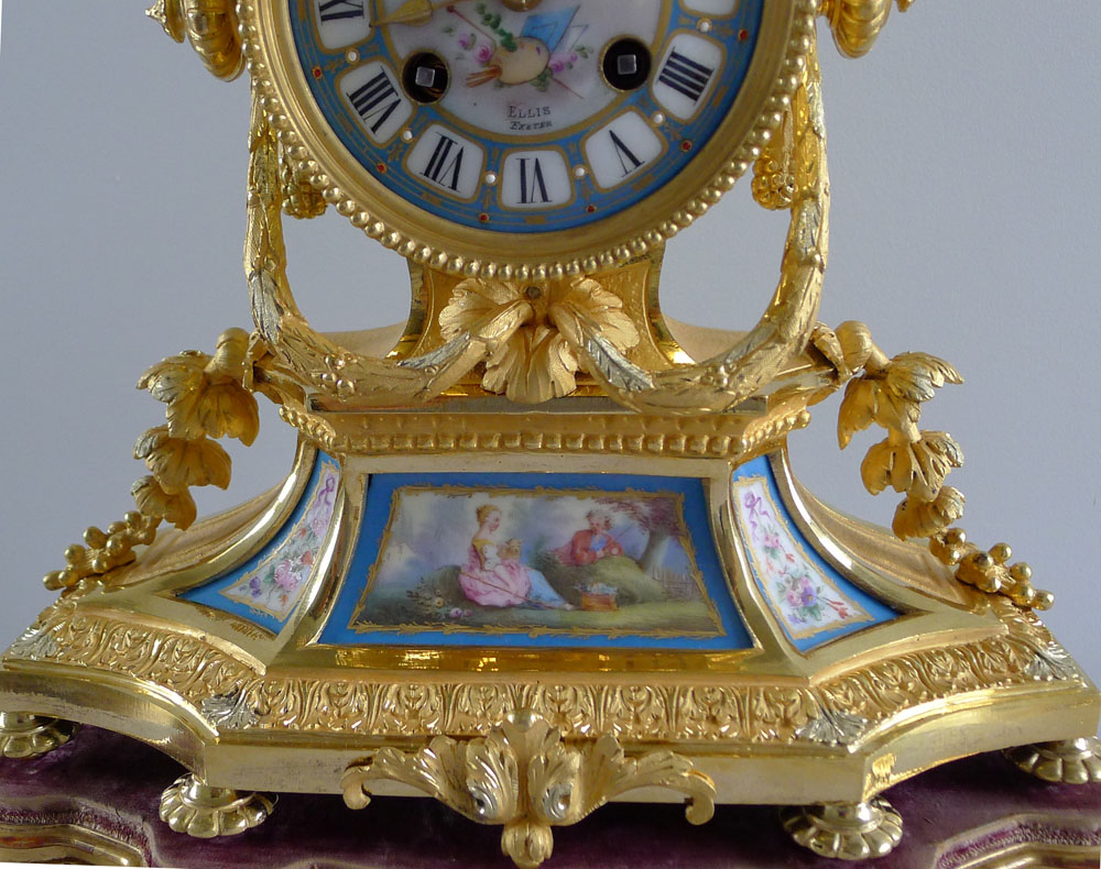 Antique French Napoleon III porcelain and ormolu mantel clock under glass dome.