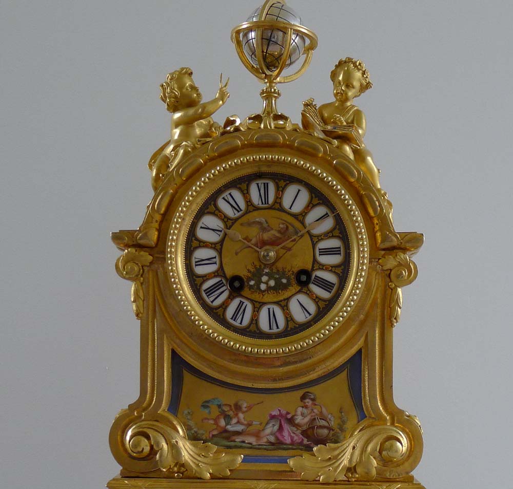 Fine antique French porcelain and ormolu mantel clock with two figures beside a globe.