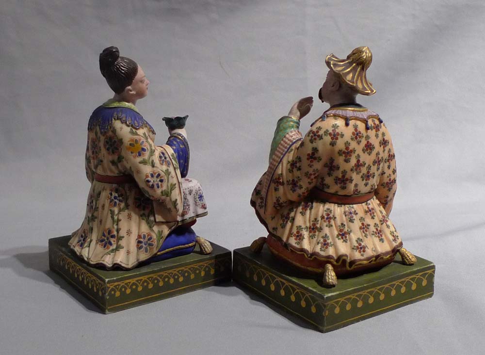 Antique French chinnoiserie pair or porcelain seated figures.