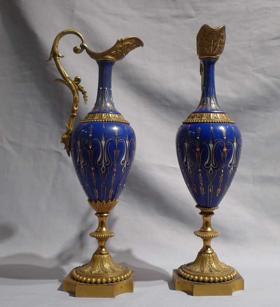 Antique French pair jewelled porcelain and ormolu ewers.