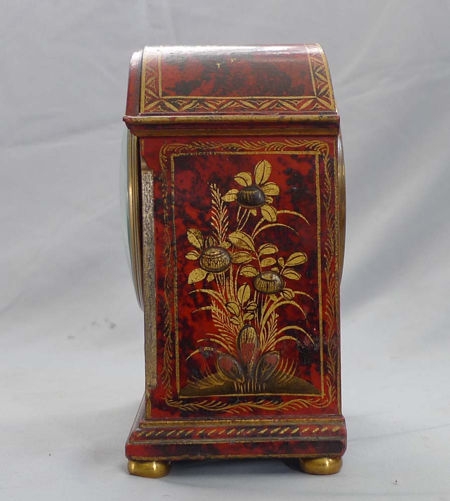 Antique Asprey chinnoiserie mantel clock in red lacquer.
