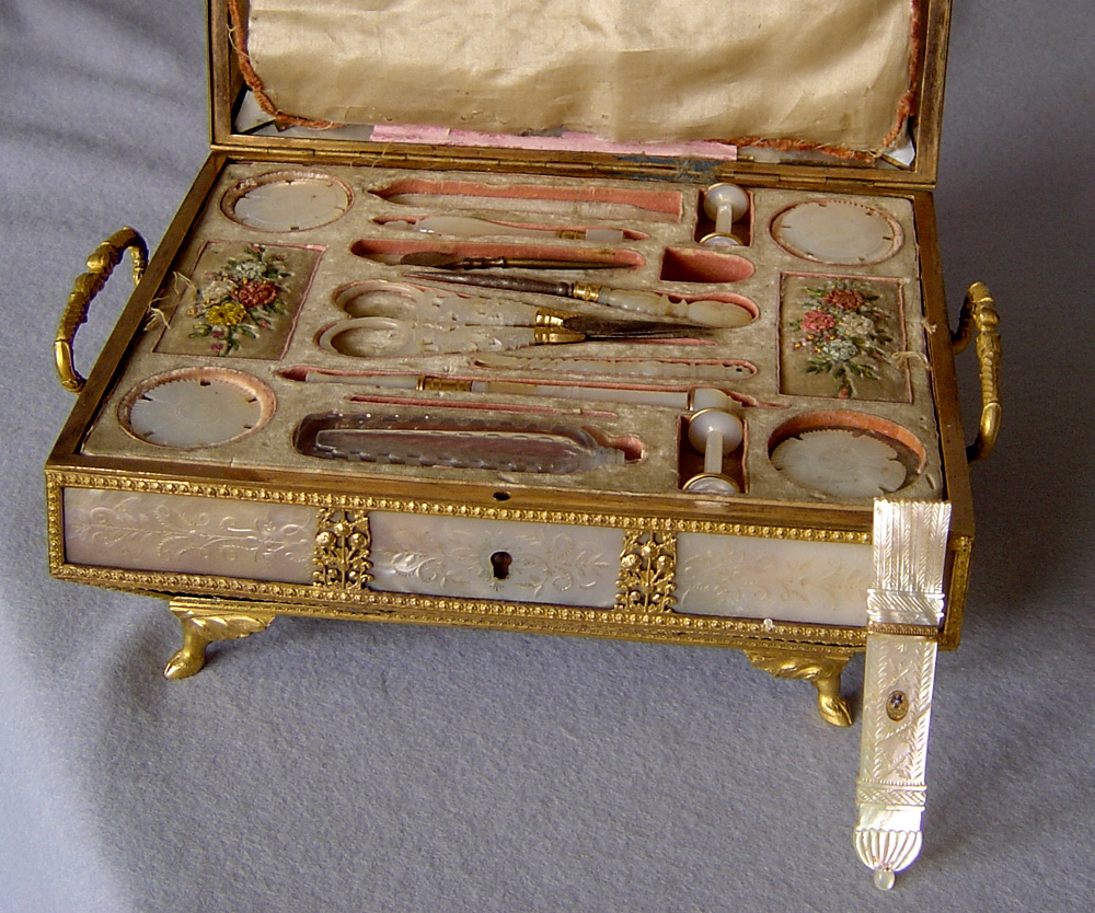 Antique grand tour Palais Royale music box and necessaire in mother of pearl and gilt bronze.