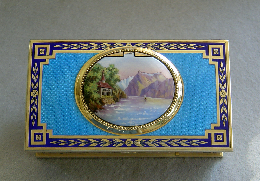 Fine French singing bird box by Juvinia in silver gilt and sky blue guilloche enamel.