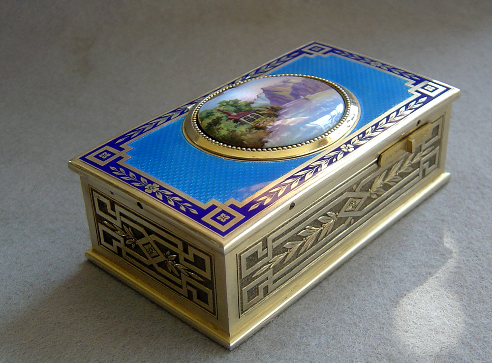Fine French singing bird box by Juvinia in silver gilt and sky blue guilloche enamel.