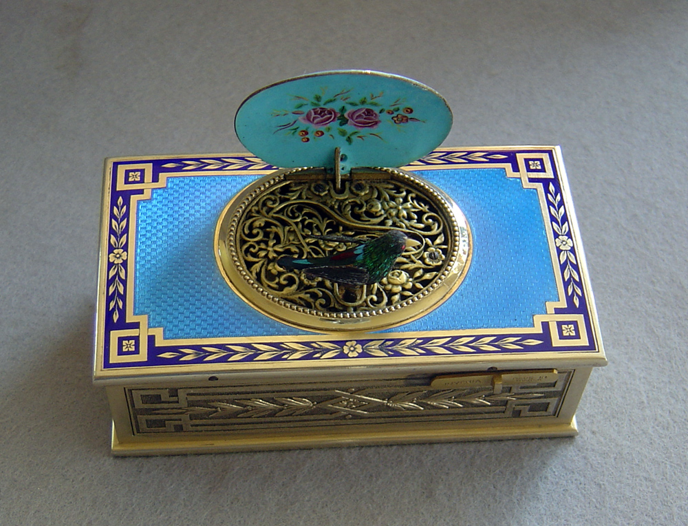 Fine French singing bird box by Juvinia in silver gilt and sky blue guilloche enamel.