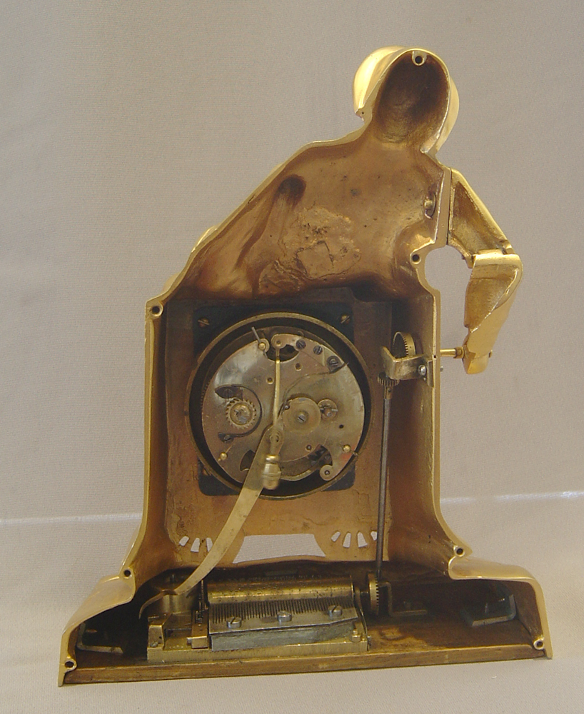 Swiss automaton organ grinder clock with musical box set off by the alarm..
