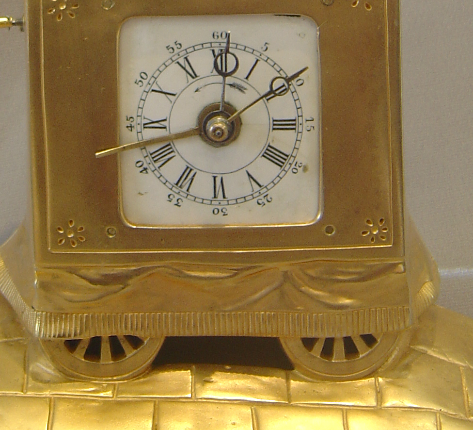 Swiss automaton organ grinder clock with musical box set off by the alarm..