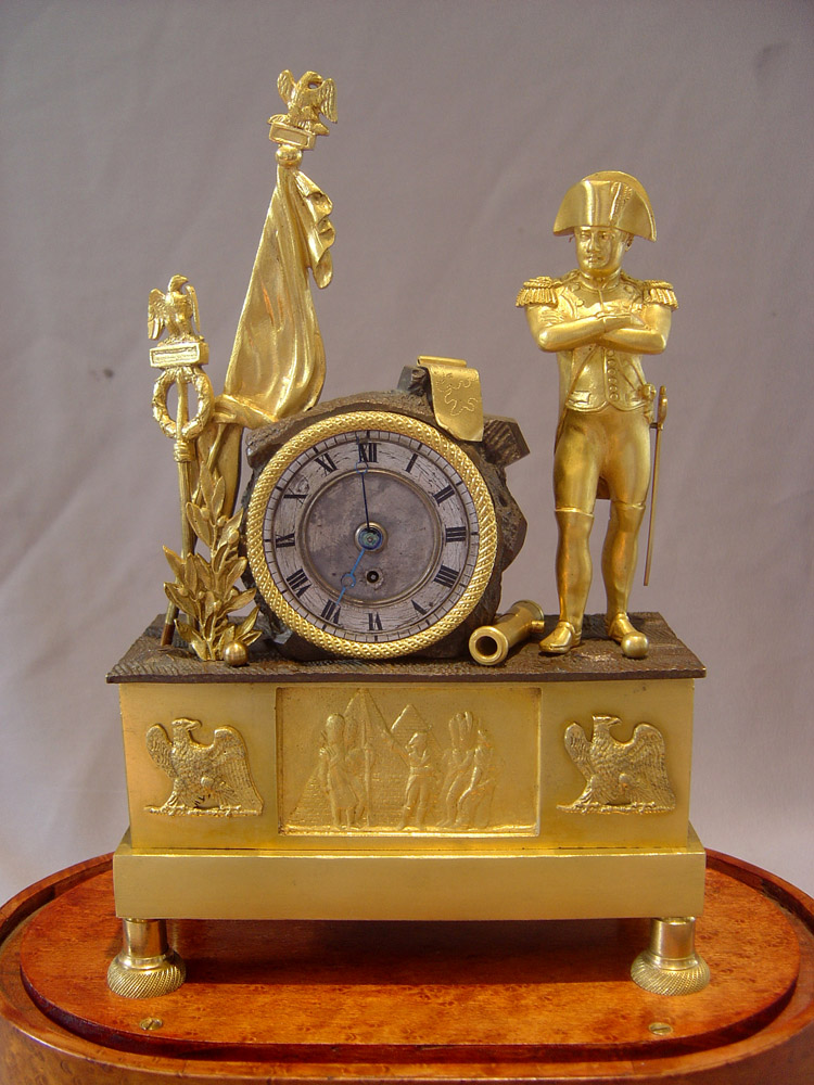 Napoleon Empire Egyptian theme mantel clock with musical movement signed Alibert.
