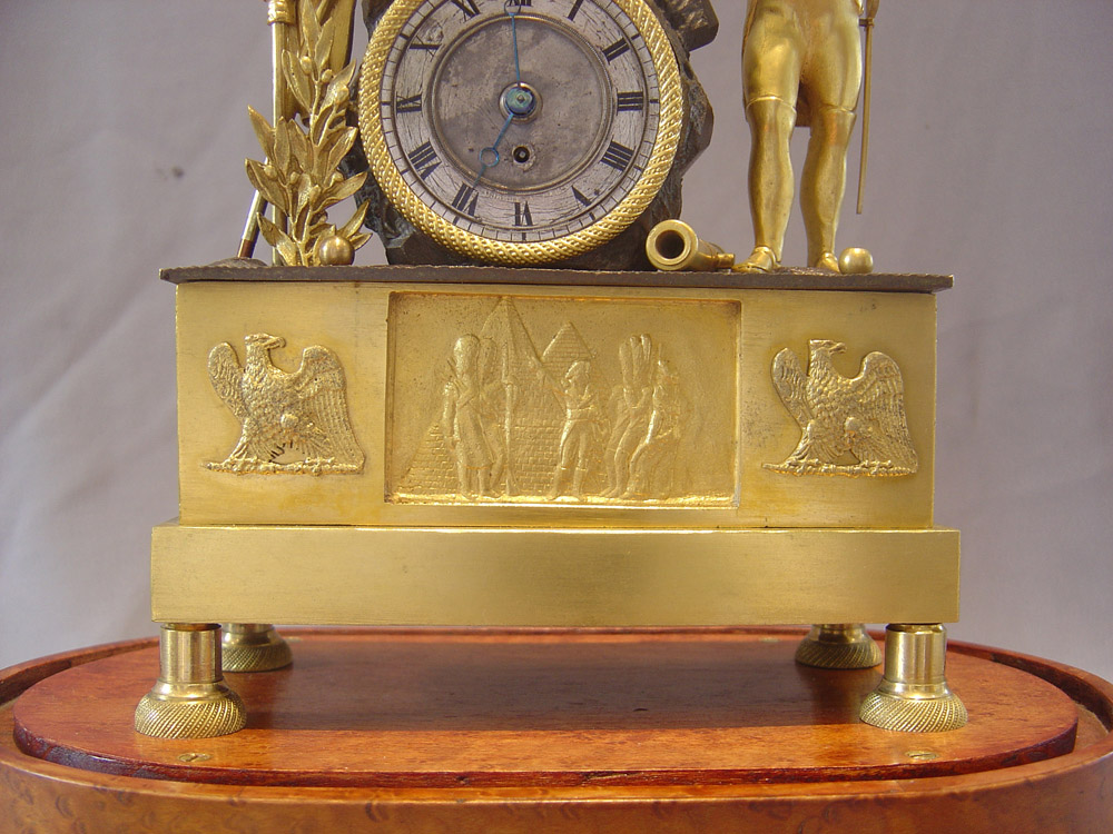 Napoleon Empire Egyptian theme mantel clock with musical movement signed Alibert.