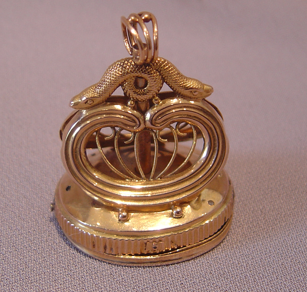 Gold musical fob.