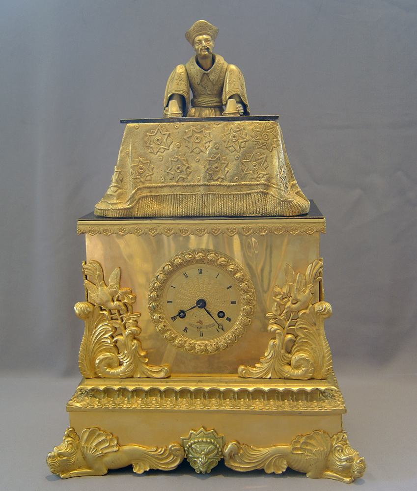 Magician automaton clock by Houdin.