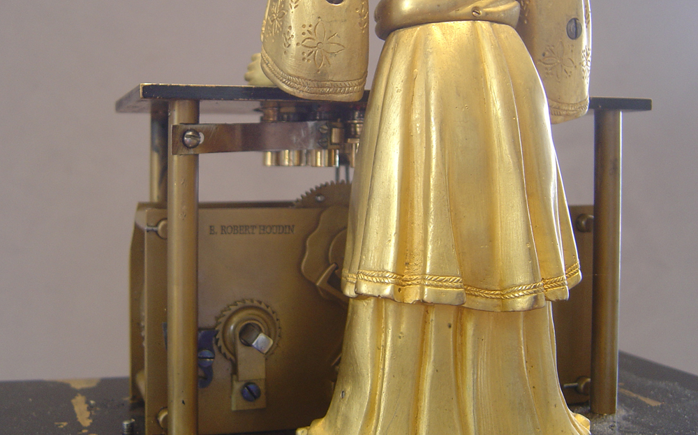 Magician automaton clock by Houdin.