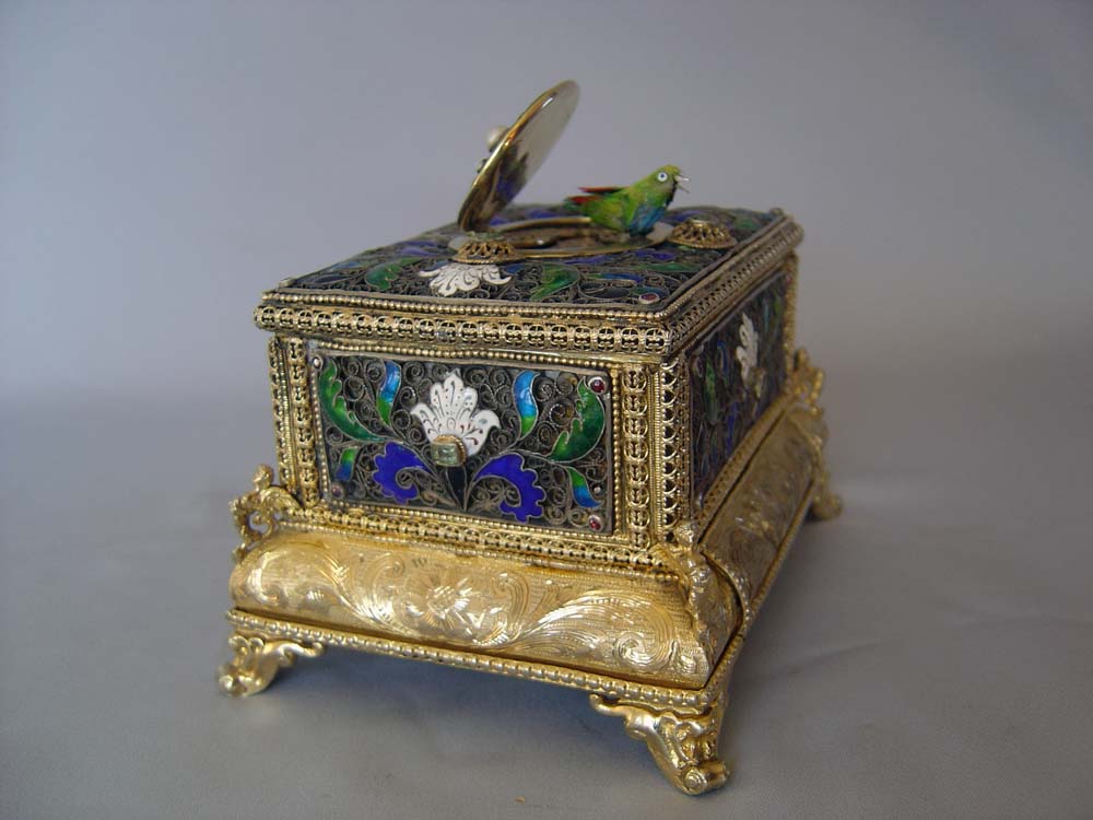 automaton singing bird box in silver filigree and silver gilt with enamel.