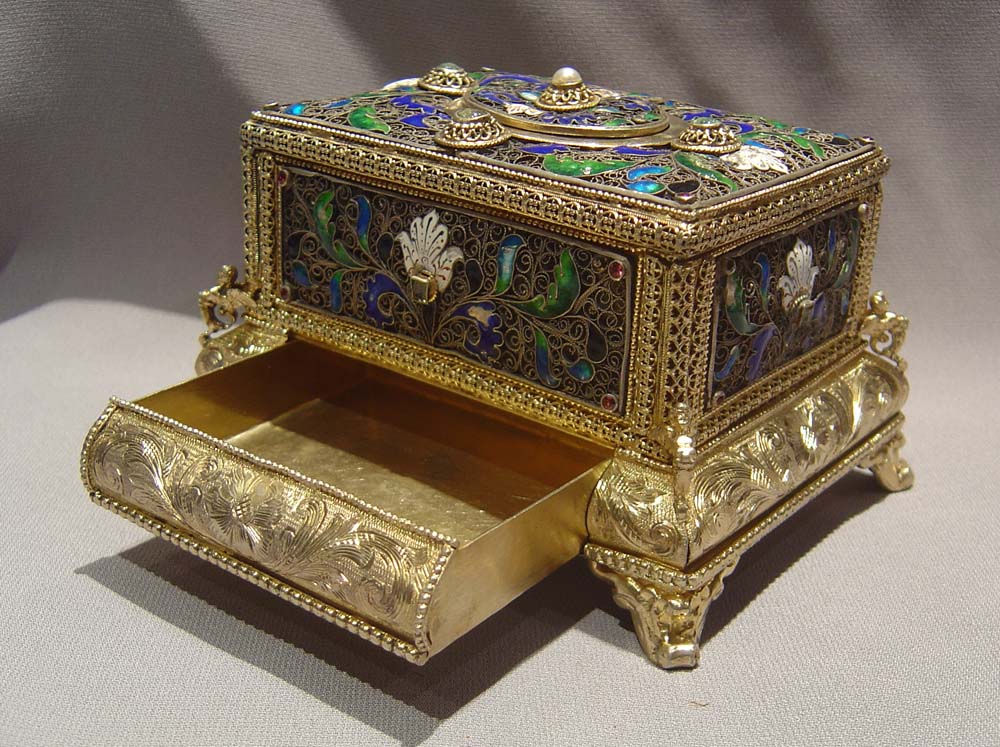 automaton singing bird box in silver filigree and silver gilt with enamel.