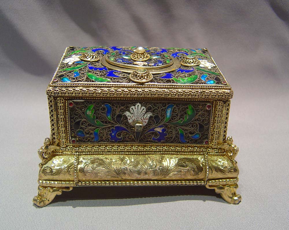 automaton singing bird box in silver filigree and silver gilt with enamel.