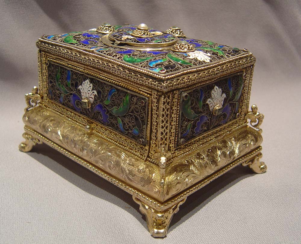 automaton singing bird box in silver filigree and silver gilt with enamel.