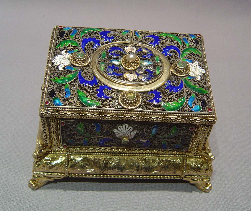 automaton singing bird box in silver filigree and silver gilt with enamel.