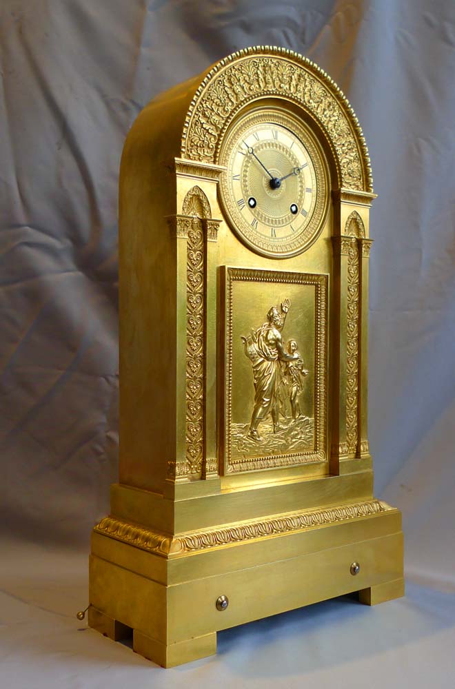 French Empire antique ormolu mantel clock with musical movement.