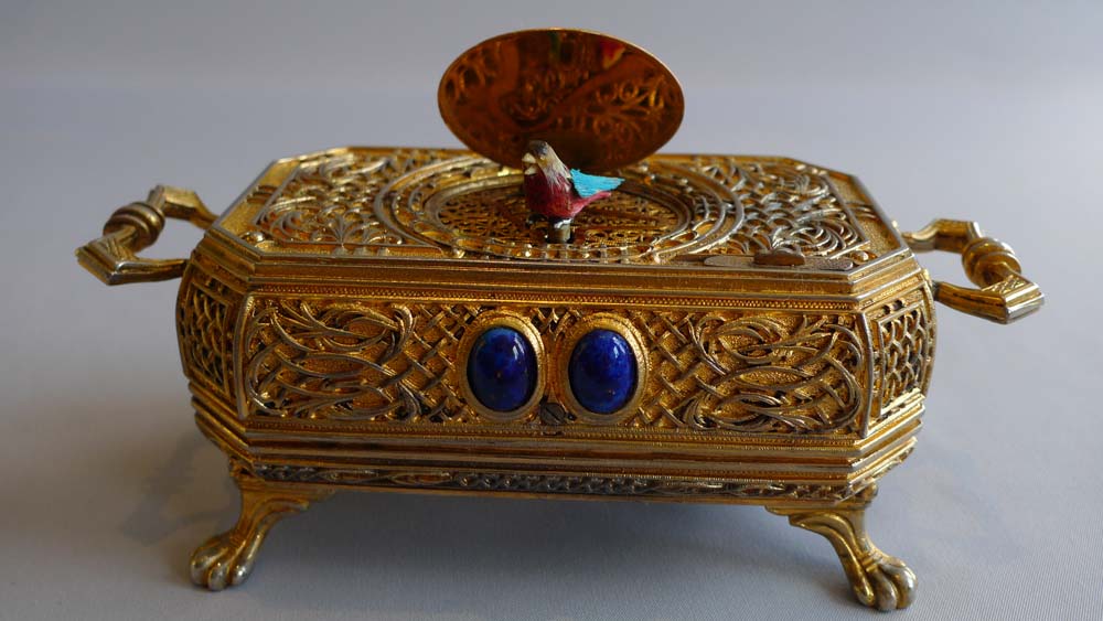 Singing bird box automaton in gilt bronze, jewelled case with miniature to lid.