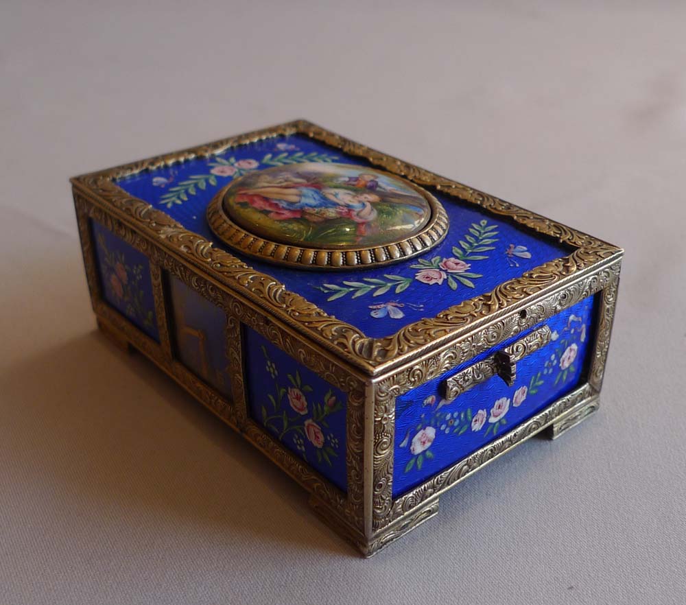 Rare singing bird box in silver and blue guilloche enamel with watch to front of case.