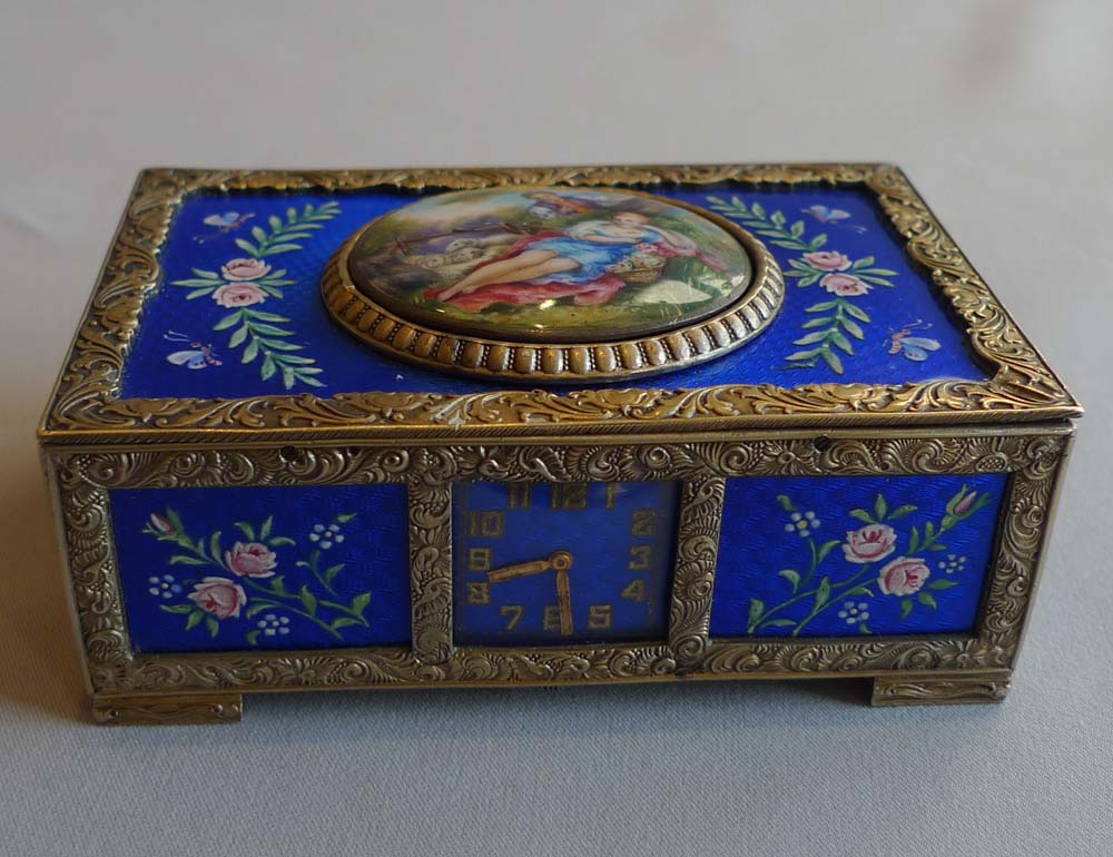 Rare singing bird box in silver and blue guilloche enamel with watch to front of case.