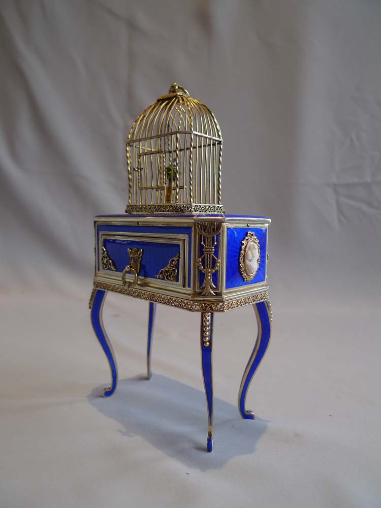 Rare singing bird box in silver gilt, iridescent blue guilloche enamel and ivory.