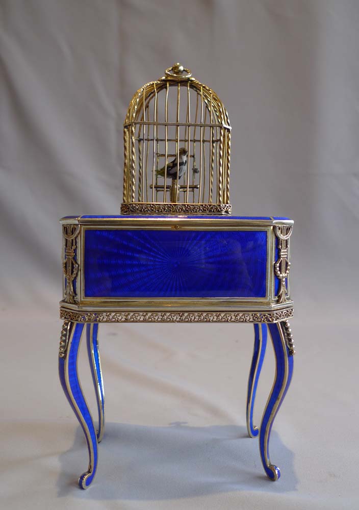 Rare singing bird box in silver gilt, iridescent blue guilloche enamel and ivory.
