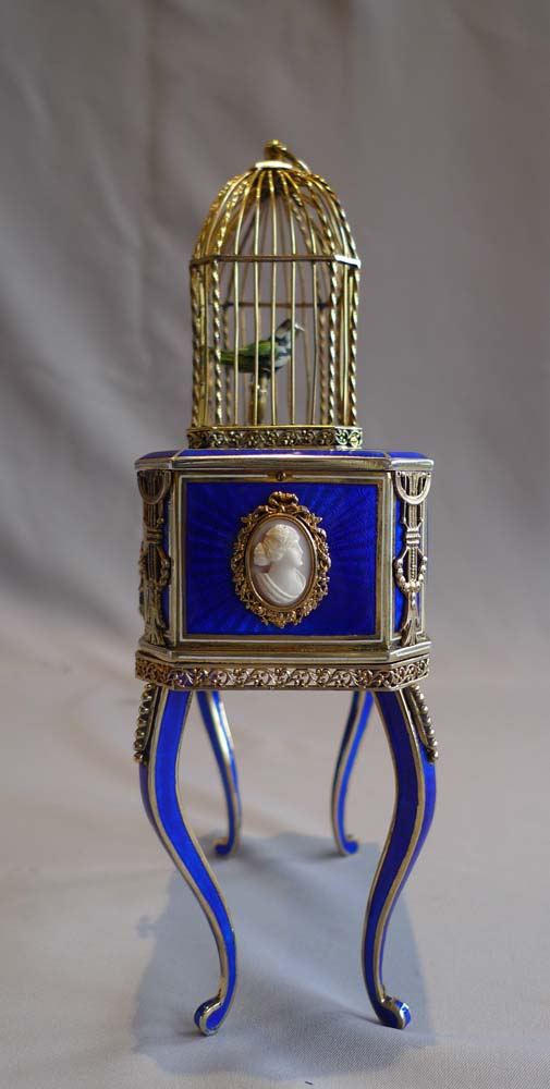 Rare singing bird box in silver gilt, iridescent blue guilloche enamel and ivory.
