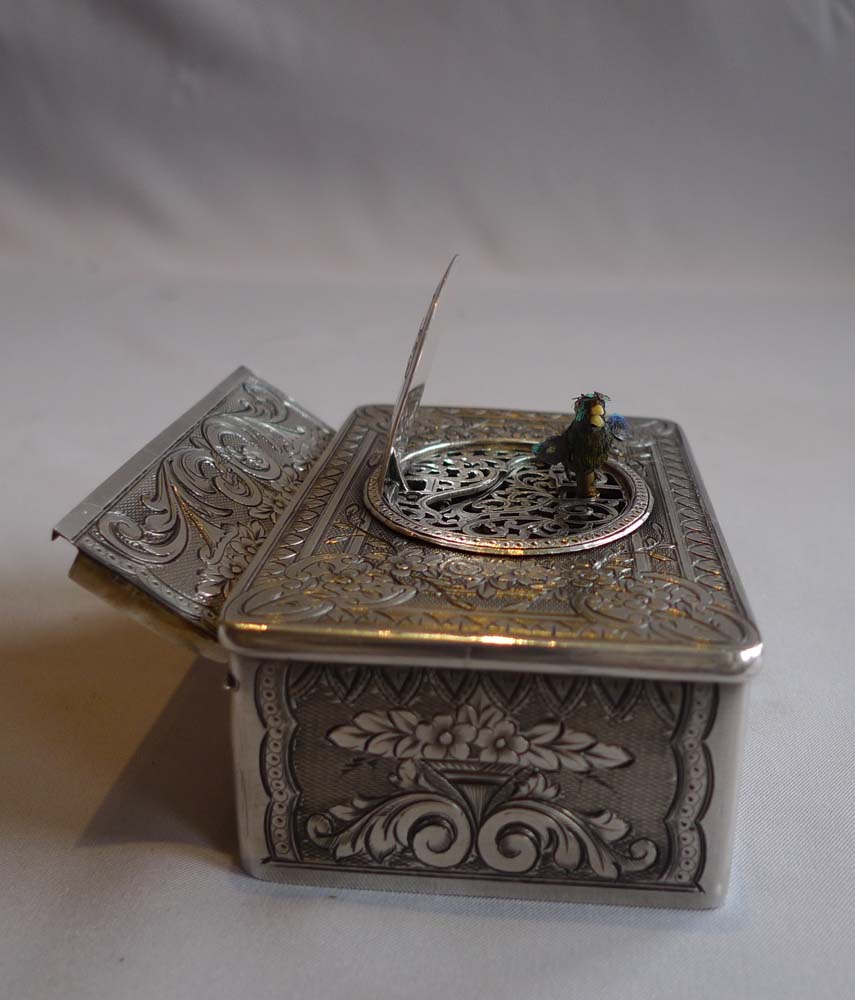 Antique singing bird box in silver with original box by unusual Swiss maker.